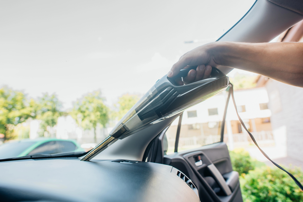 vacuuming a car